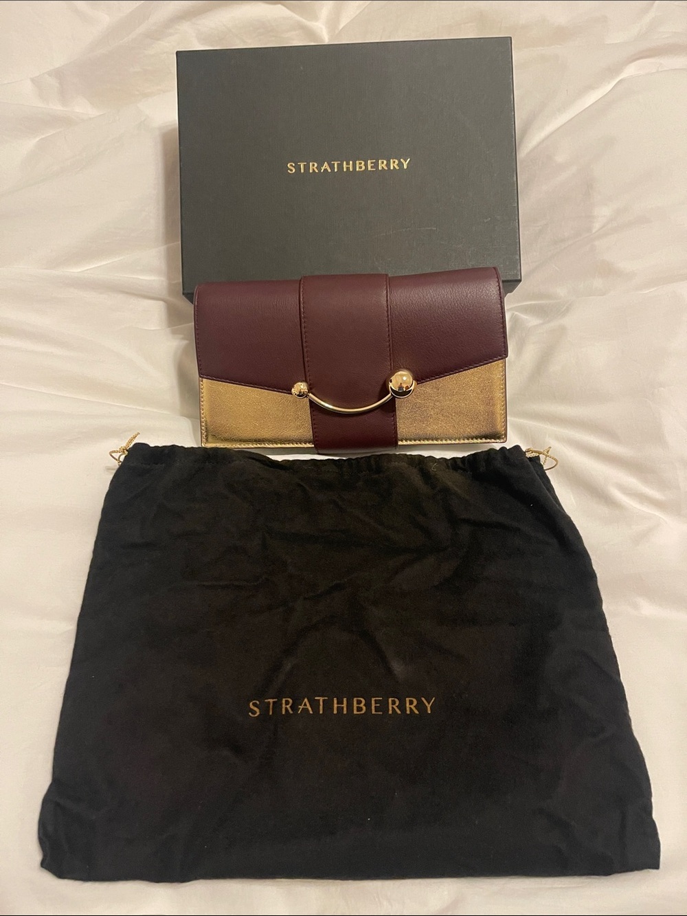Strathberry Burgundy and Gold Small Clutch with Curved Bar